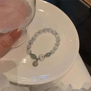 猫眼石镂空福牌弹力串珠手链