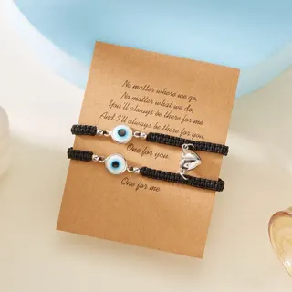 Bracelet tissé œil protecteur, lot couple et amies, cordon noir avec œil bleu en résine et breloque cœur en argent, cordon tissé à la main, réglable de 18 à 30 cm, carte message et emballage inclus, cadeau porte-bonheur et protection